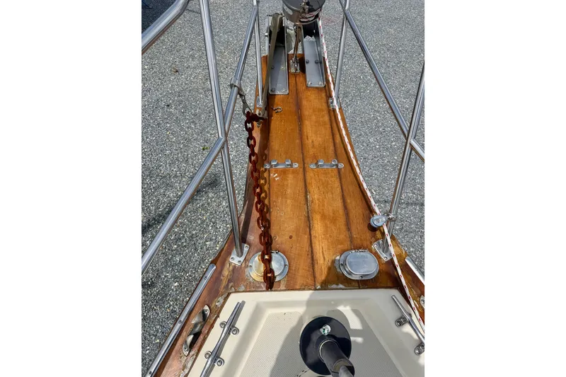Slide: The Image of Bow of 1992 Island Packet 29 sailboat with wooden deck and anchor chain. - 4