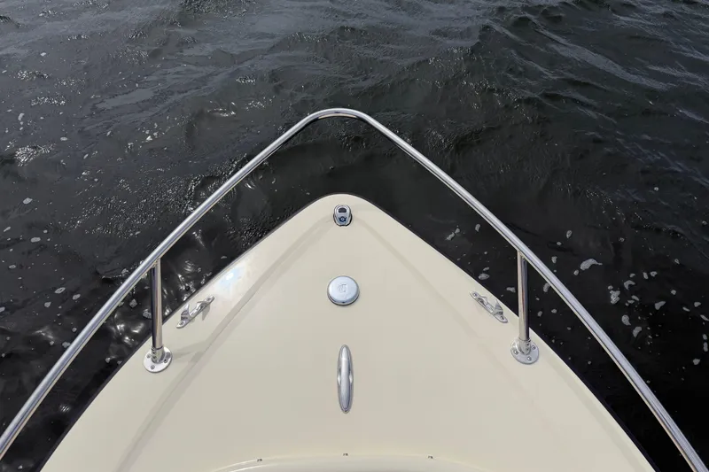 Slide: The Image of Bow of 2027 Rossiter 14 boat navigating through dark waters. - 32