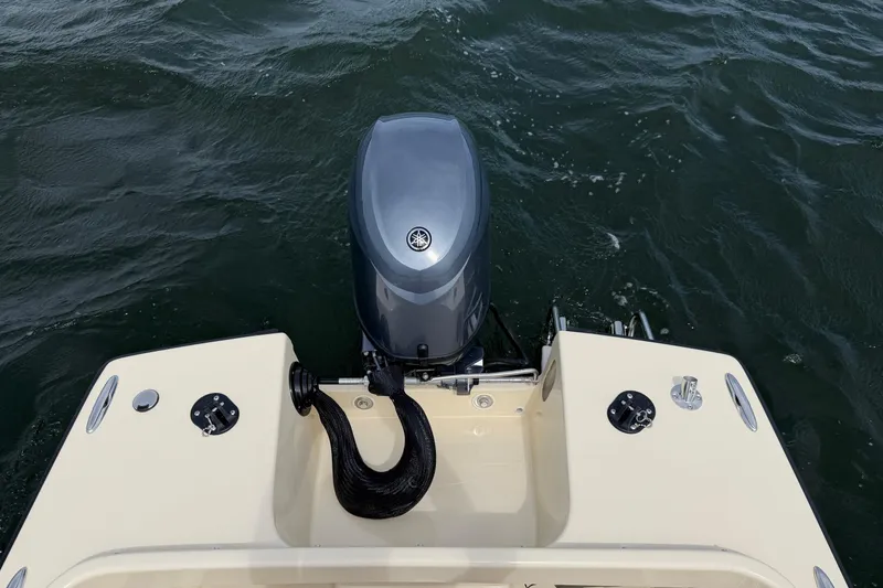 Slide: The Image of 2027 Rossiter 14 boat with outboard motor on water. - 13