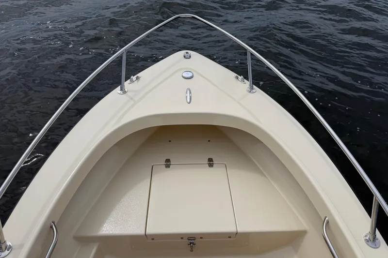 Slide: The Image of Bow view of 2027 Rossiter 14 boat on water, showcasing sleek design and craftsmanship. - 30