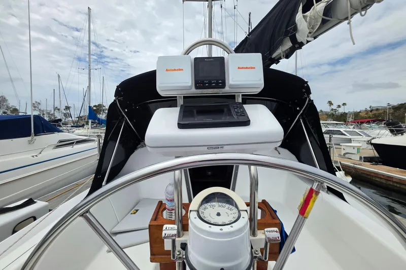 Slide: The Image of Cockpit view of a 1999 Catalina 270 sailboat with navigation equipment. - 11