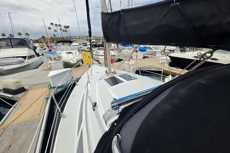 Slide: The Image of Sailboats docked at a marina, featuring a 1999 Catalina 270 model. - 3