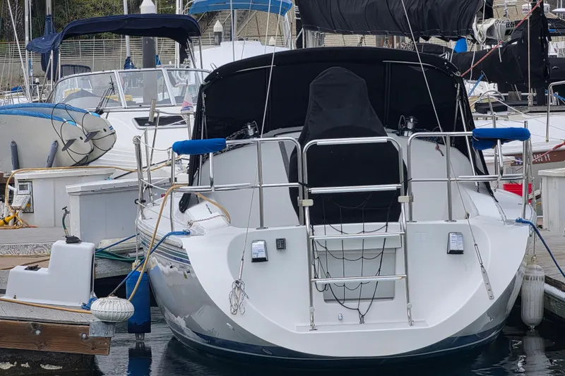 Slide: The Image of Catalina 270 sailboat, 1999 model, docked at marina with other boats. - 5