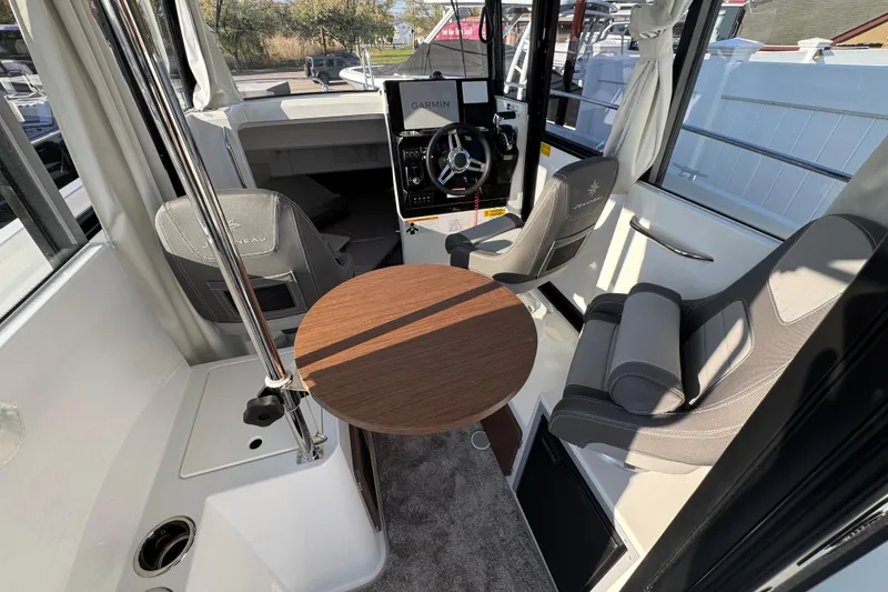 Slide: The Image of Interior of 2026 Jeanneau NC Sport 795 Series 2 boat with seating and steering wheel. - 14