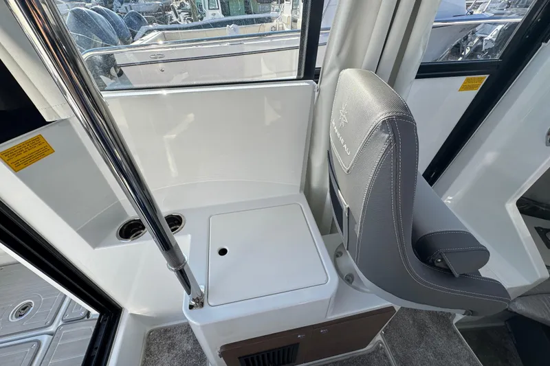 Slide: The Image of Interior of 2026 Jeanneau NC Sport 795 Series 2 boat with seating and storage. - 16