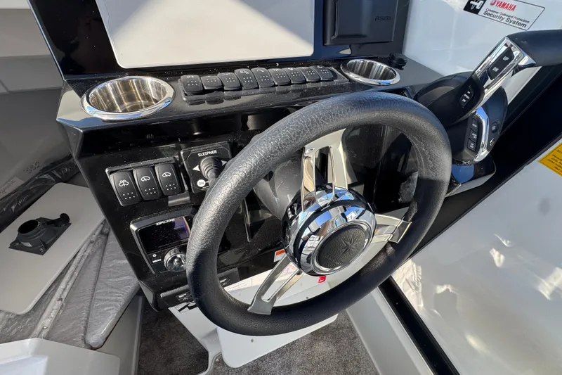 Slide: The Image of Steering wheel and controls of 2026 Jeanneau NC Sport 795 Series 2 boat. - 19