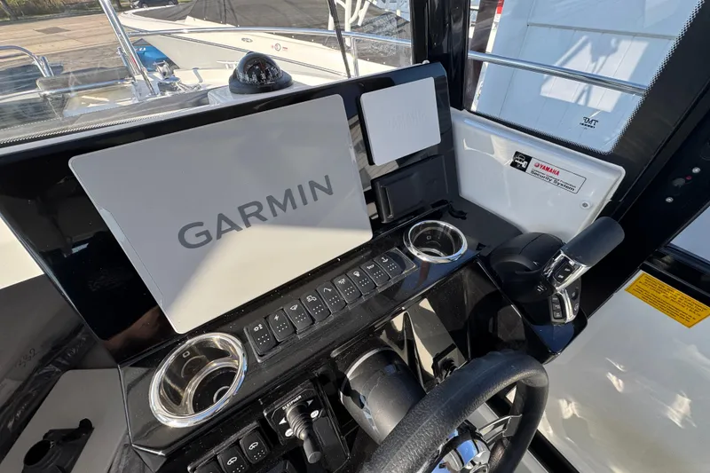 Slide: The Image of Cockpit of 2026 Jeanneau NC Sport 795 Series 2 with Garmin navigation system. - 23