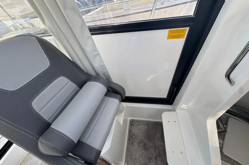 Slide: The Image of Interior of 2026 Jeanneau NC Sport 795 Series 2, featuring a sleek, modern seat design. - 24