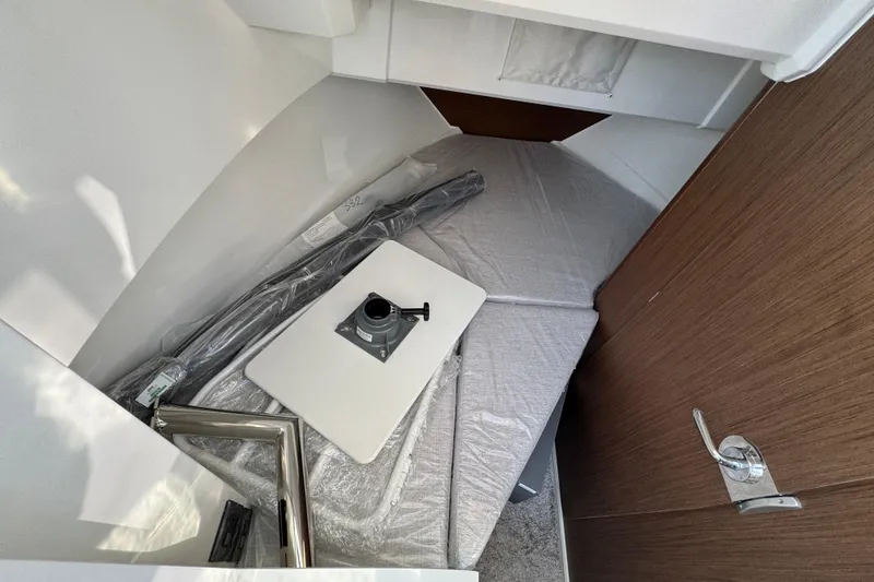 Slide: The Image of Interior cabin of 2026 Jeanneau NC Sport 795 Series 2 boat, featuring compact sleeping area. - 25