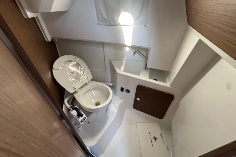 Slide: The Image of 2026 Jeanneau NC Sport 795 Series 2 boat bathroom with toilet and sink. - 26