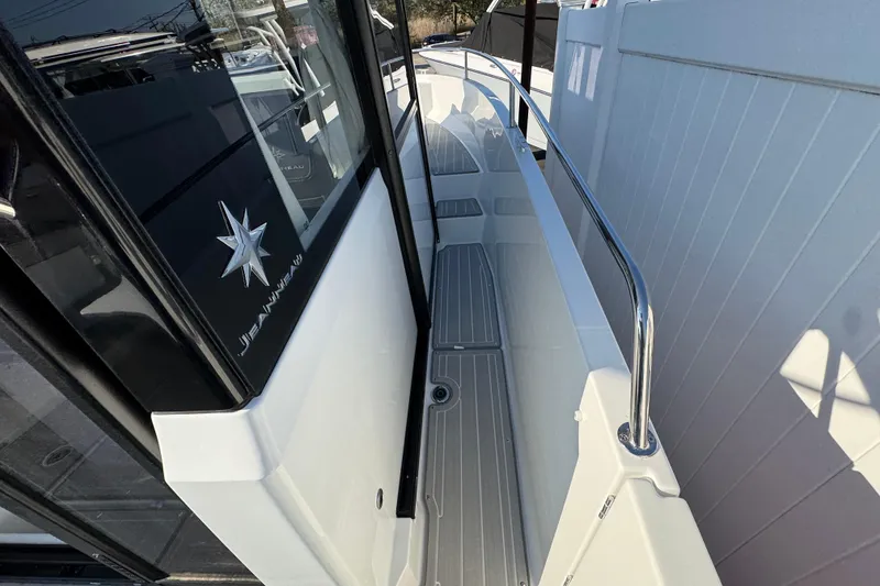 Slide: The Image of 2026 Jeanneau NC Sport 795 Series 2 boat deck with sleek design and stainless steel railing. - 27