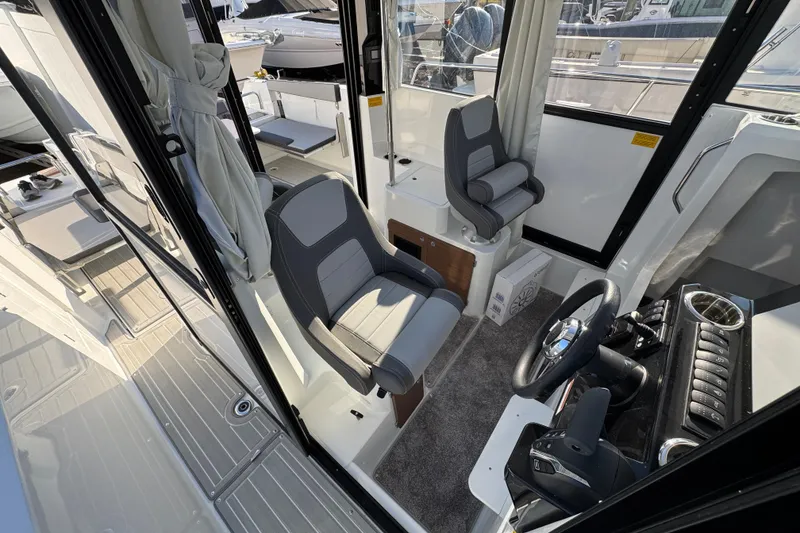 Slide: The Image of Interior view of 2026 Jeanneau NC Sport 795 Series 2 boat, featuring modern seating and controls. - 34