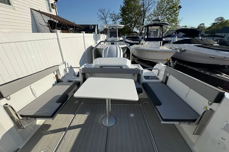 Slide: The Image of 2026 Jeanneau NC Sport 795 Series 2 boat interior with seating and table. - 4