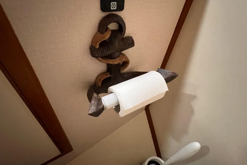 Slide: The Image of Nautical-themed toilet paper holder in 1985 Heritage East 40 Sundeck trawler bathroom. - 33