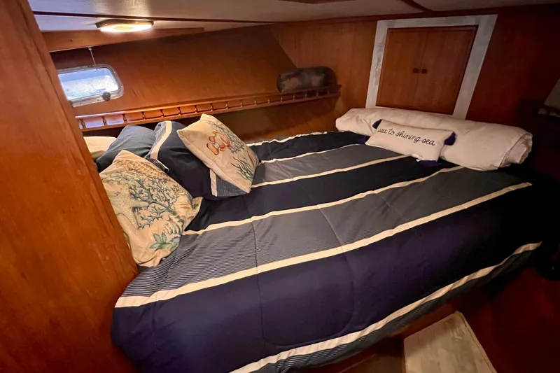 Slide: The Image of Cozy aft cabin bedroom in 1985 Heritage East 40 Sundeck Trawler with nautical decor. - 35