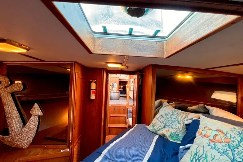 Slide: The Image of Cozy cabin interior of 1985 Heritage East 40 Sundeck Trawler with nautical decor. - 37