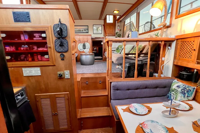 Slide: The Image of Interior of 1985 Heritage East 40 Sundeck Trawler with cozy dining and living areas. - 40