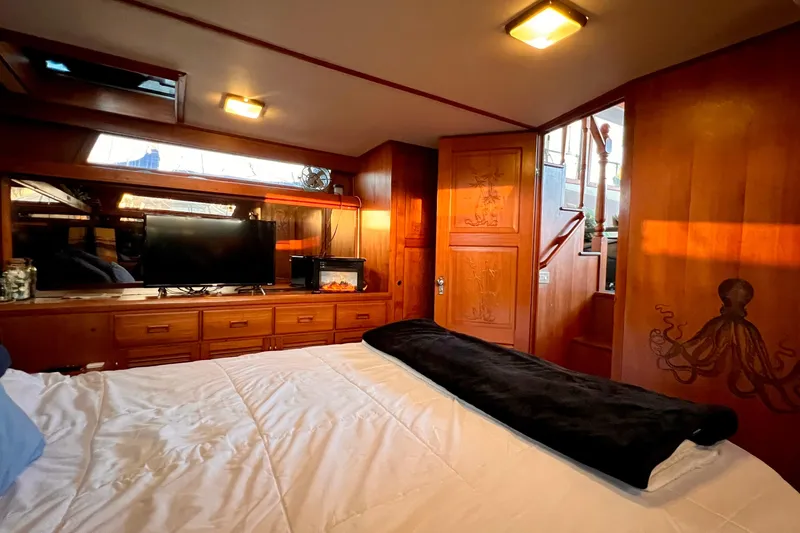 Slide: The Image of Luxurious 1985 Heritage East 40 Sundeck cabin with wood paneling and modern amenities. - 45