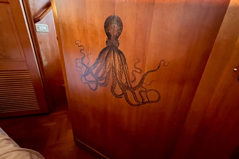 Slide: The Image of Wooden interior of 1985 Heritage East boat with octopus wall art. - 46
