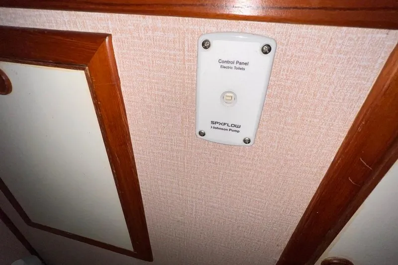 Slide: The Image of Control panel for electric toilets on 1985 Heritage East 40 Sundeck trawler. - 58