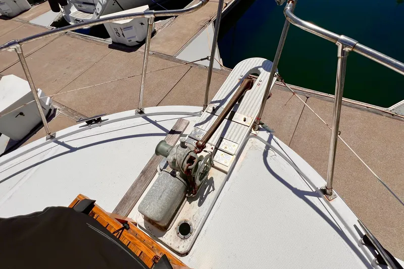 Slide: The Image of 1985 Heritage East 40 Sundeck Trawler deck with railing and winch mechanism. - 8