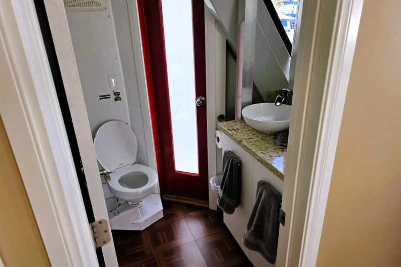 Slide: The Image of Bathroom interior of 1991 Bluewater Yachts 5900 Coastal Cruiser with modern fixtures. - 19