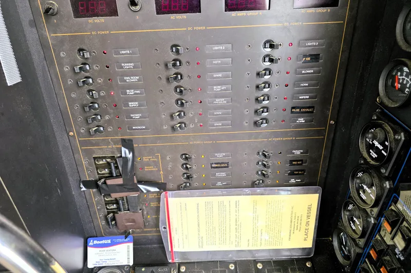 Slide: The Image of Control panel of a 1991 Bluewater Yachts 5900 Coastal Cruiser with switches and gauges. - 9