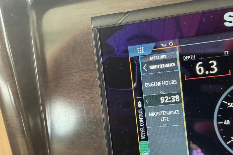 Slide: The Image of Close-up of a 2023 Harris Cruiser 250 CW dashboard displaying engine hours and depth. - 15