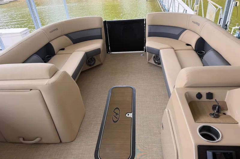 Slide: The Image of 2023 Harris Cruiser 250 CW boat interior with beige seating and modern amenities. - 17