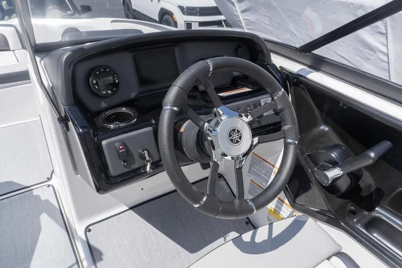 Slide: The Image of 2026 Yamaha Boats AR195 steering console with modern controls and sleek design. - 10