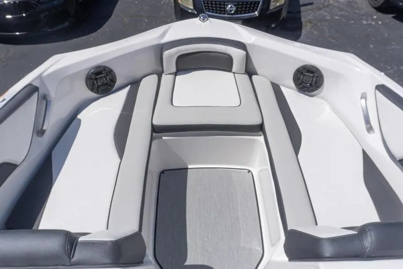 Slide: The Image of 2026 Yamaha Boats AR195 interior with cushioned seating and built-in speakers. - 12