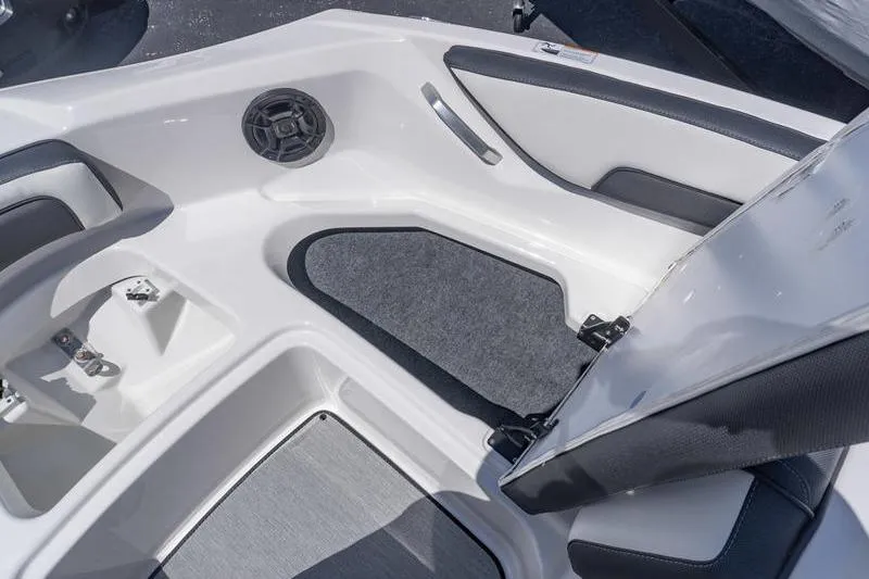 Slide: The Image of 2026 Yamaha Boats AR195 interior with seating, speaker, and storage compartment. - 15
