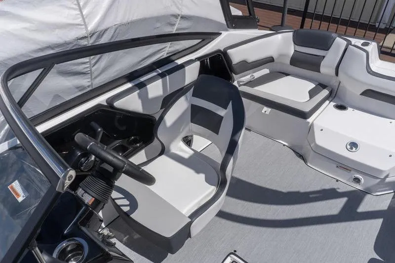 Slide: The Image of 2026 Yamaha Boats AR195 interior with sleek seating and modern dashboard design. - 19