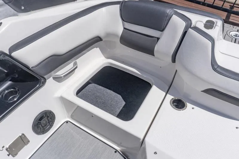 Slide: The Image of Interior seating of 2026 Yamaha Boats AR195, featuring sleek design and storage space. - 22