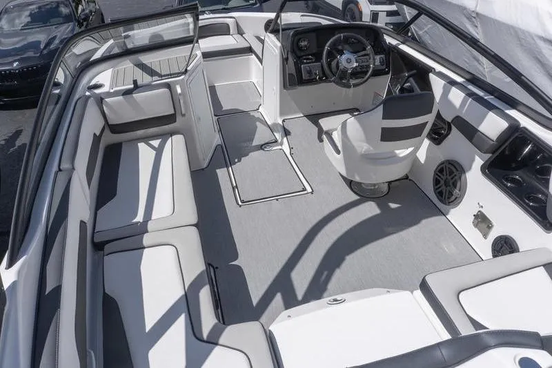 Slide: The Image of 2026 Yamaha Boats AR195 interior with sleek seating and modern dashboard design. - 6