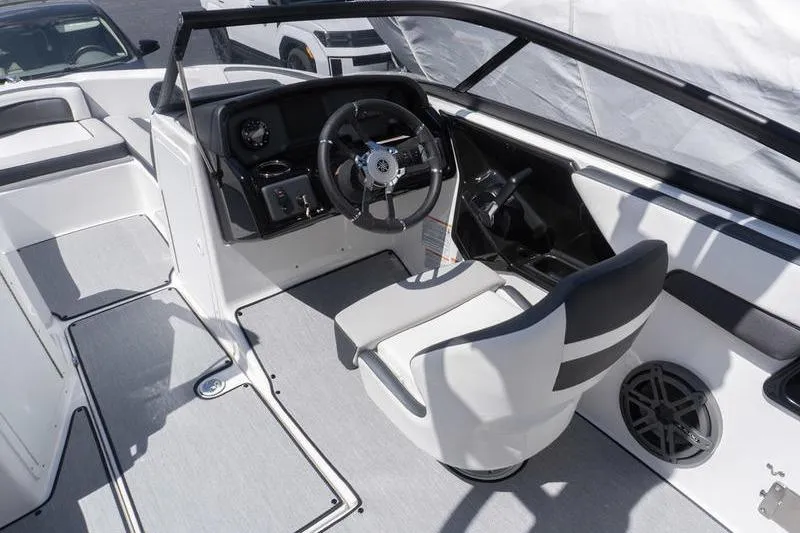 Slide: The Image of 2026 Yamaha Boats AR195 interior with steering wheel and seating. - 9