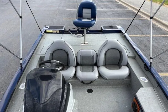 Slide: The Image of 2017 G3 Sportsman 1710 Vinyl boat interior with seating and steering console. - 13
