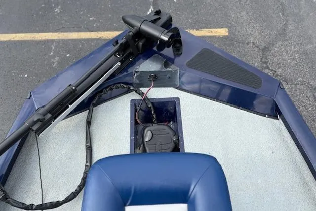 Slide: The Image of 2017 G3 Sportsman 1710 Vinyl boat interior with trolling motor and blue seating. - 14