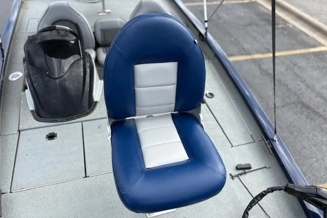 Slide: The Image of 2017 G3 Sportsman 1710 Vinyl boat seat, blue and gray design, on deck. - 15