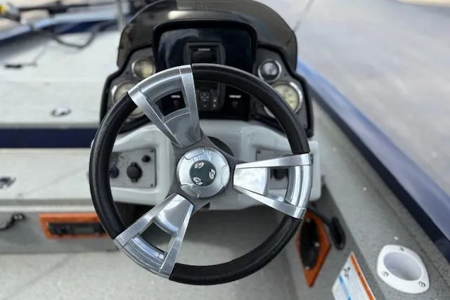 Slide: The Image of Steering wheel of 2017 G3 Sportsman 1710 Vinyl boat, featuring modern dashboard controls. - 18