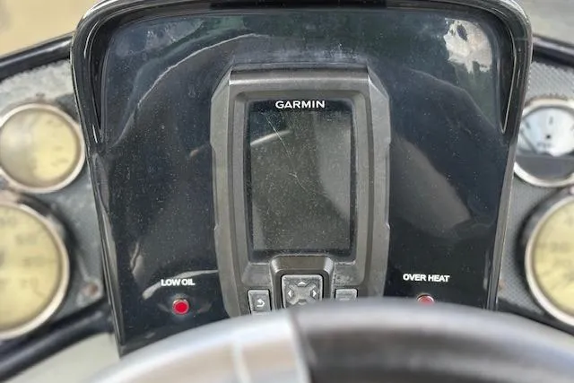 Slide: The Image of Dashboard of 2017 G3 Sportsman 1710 Vinyl with Garmin display and warning indicators. - 19