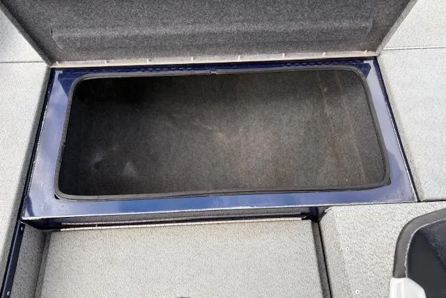 Slide: The Image of Open storage compartment in 2017 G3 Sportsman 1710 Vinyl boat. - 29