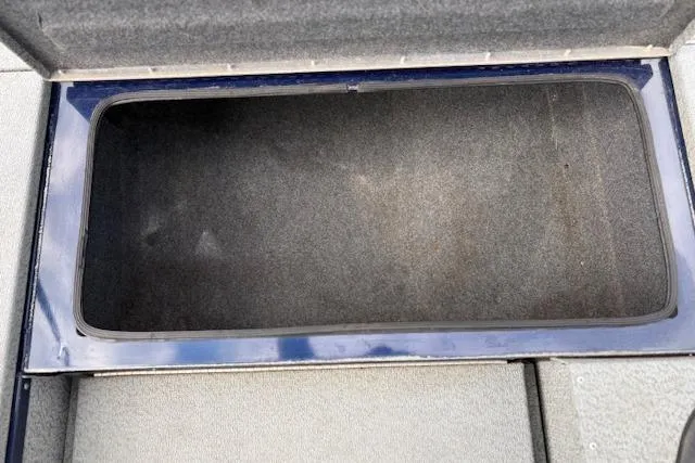 Slide: The Image of Open storage compartment in 2017 G3 Sportsman 1710 Vinyl boat. - 30