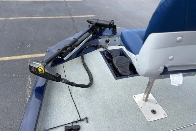 Slide: The Image of 2017 G3 Sportsman 1710 Vinyl boat with blue seating and trolling motor. - 34