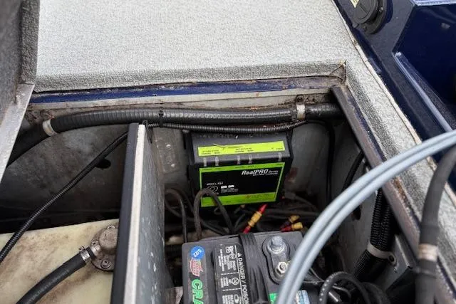 Slide: The Image of 2017 G3 Sportsman 1710 Vinyl boat battery compartment with wiring and components. - 39