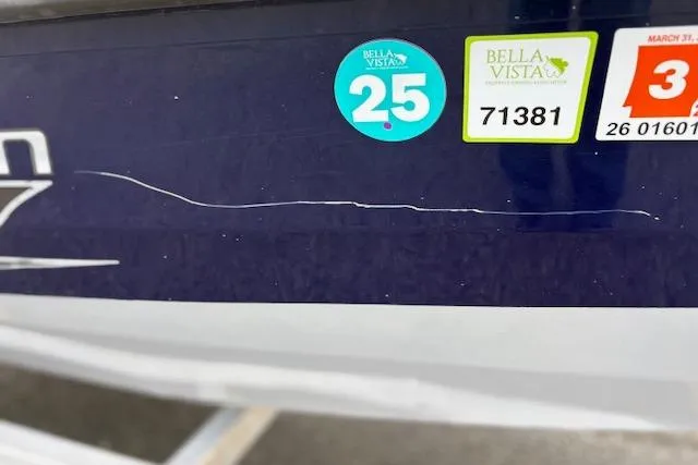 Slide: The Image of 2017 G3 Sportsman 1710 Vinyl boat with registration stickers and visible scratch. - 40
