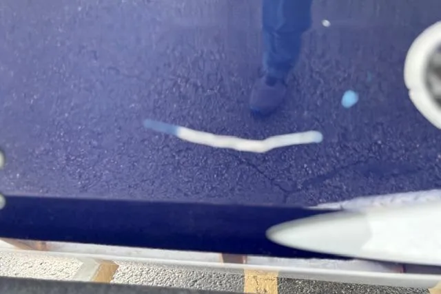 Slide: The Image of Reflection on 2017 G3 Sportsman 1710 Vinyl boat surface with visible scratch. - 43