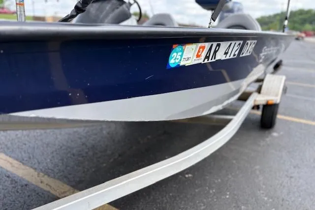 Slide: The Image of 2017 G3 Sportsman 1710 Vinyl boat on trailer, close-up view of hull and registration. - 46