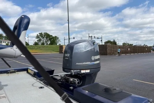Slide: The Image of 2017 G3 Sportsman 1710 Vinyl boat with Yamaha 90 engine in parking lot. - 49