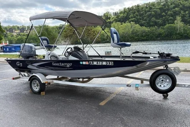 Slide: The Image of 2017 G3 Sportsman 1710 Vinyl boat on trailer by a scenic lake. - 5